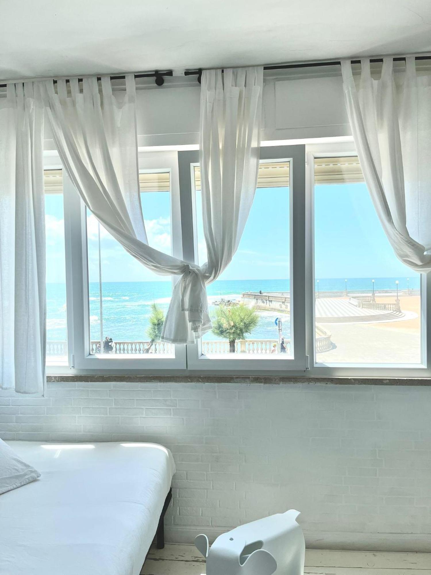 Апартаменты Sunset Loft Ливорно Номер фото